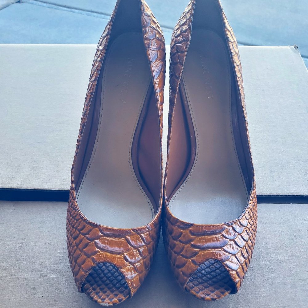 Gently used snakeskin print heels by Nine West